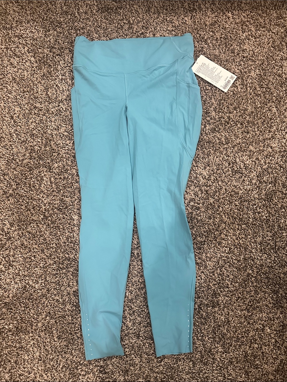 Fast and Free High-Rise Tight 28"
5 Pocket Washed Blue NWT Sz 12